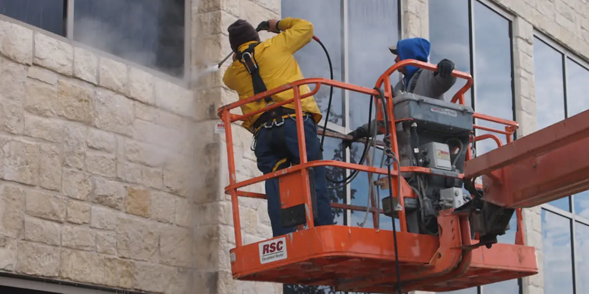 Photo of a commercial building being pressure washed