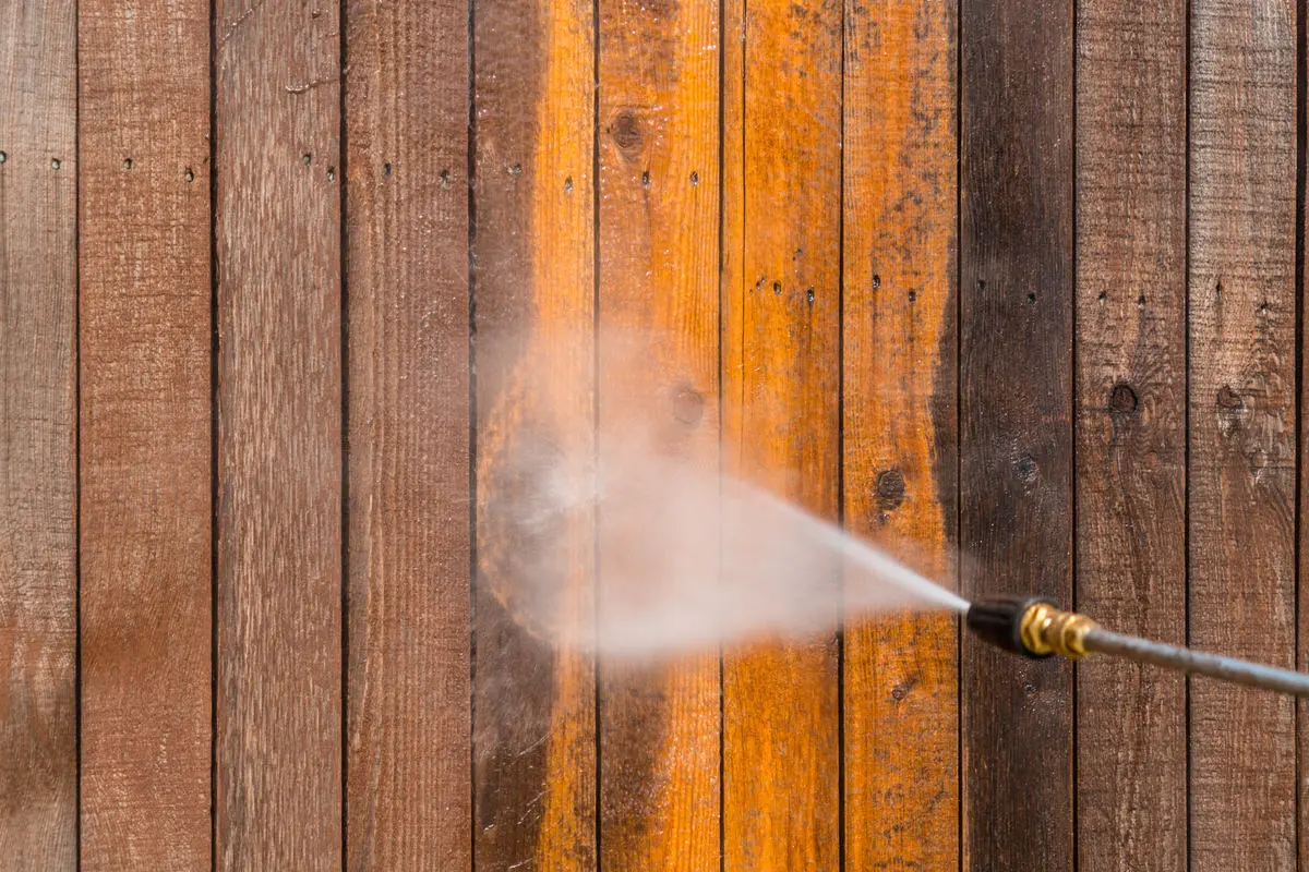 Photo of a fence being pressure washed in Albany, NY